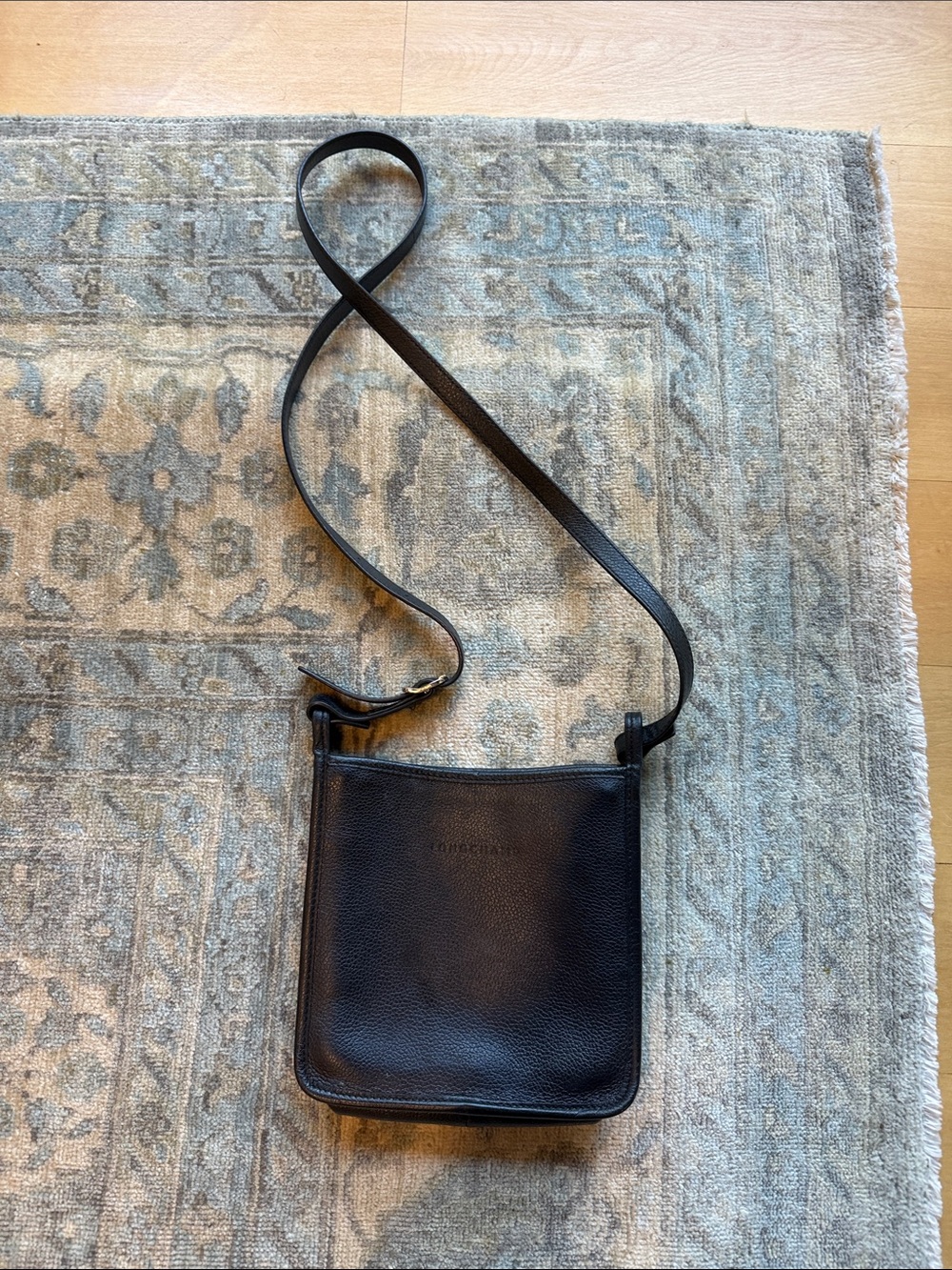 Black leather Longchamp crossbody purse